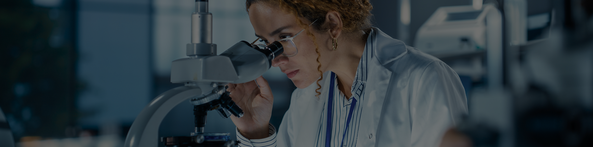Researcher with microscope